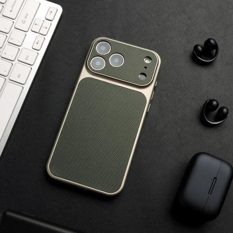 Phone case on a desk with keyboard and earbuds