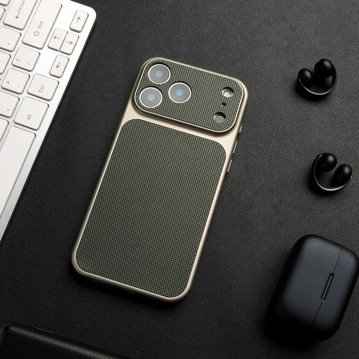 Phone case on a desk with keyboard and earbuds